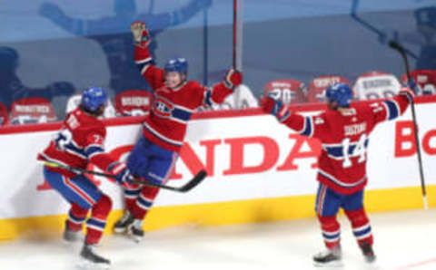 Jun 18, 2021; Montreal, Quebec, CAN; Montreal Canadiens Cole Caufield Tyler Toffoli and Nick Suzuki Mandatory Credit: Jean-Yves Ahern-USA TODAY Sports