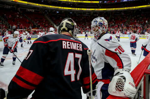 RALEIGH, NC – JANUARY 03: Carolina Hurricanes Goalie James Reimer (47) and Washington Capitals Goalie Braden Holtby (70) catch up during warmups just prior to an NHL game between the Carolina Hurricanes and the Washington Capitals on January 3, 2020 at the PNC Arena in Raleigh, NC. (Photo by John McCreary/Icon Sportswire via Getty Images)