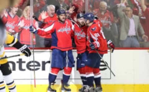 Washington Capitals left wing Alex Ovechkin (8) celebrates with teammates while rocking the red (Geoff Burke-USA TODAY Sports)