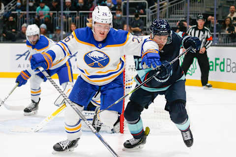 Nov 4, 2021; Seattle, Washington, USA; Buffalo Sabres defenseman Rasmus Dahlin (26) skates against Seattle Kraken right wing Joonas Donskoi (72) during the second period at Climate Pledge Arena. Mandatory Credit: Joe Nicholson-USA TODAY Sports