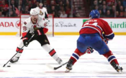 Mar 19, 2017; Montreal, Quebec, CAN; Ottawa Senators defenseman Erik Karlsson (65) plays the puck against Montreal Canadiens defenseman Alexei Emelin (74) during the third period at Bell Centre. Mandatory Credit: Jean-Yves Ahern-USA TODAY Sports