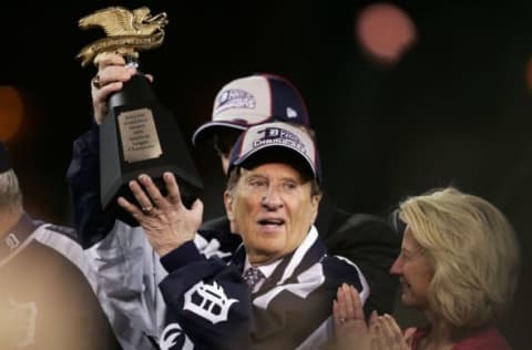 DETROIT – OCTOBER 14: Michael Ilitch, owner of the Detroit Tigers celebrates with the AMerican League Championship trophy after the Tigers won 6-3 against the Oakland Athletics during Game Four of the American League Championship Series October 14, 2006 at Comerica Park in Detroit, Michigan. With the win the Tigers advanced to the World Series. (Photo by Jonathan Daniel/Getty Images)