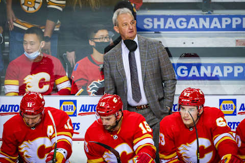 Dec 11, 2021; Calgary, Alberta, CAN; Calgary Flames head coach Darryl Sutter on his bench against the Boston Bruins during the third period at Scotiabank Saddledome. Mandatory Credit: Sergei Belski-USA TODAY Sports