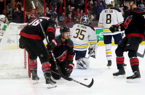 RALEIGH, NC – MARCH 16: Lucas Wallmark #71 of the Carolina Hurricanes scores a goal and celebrates with teammates Jordan Martinook #48 and Micheal Ferland #79 during an NHL game against the Buffalo Sabres on March 16, 2019 at PNC Arena in Raleigh, North Carolina. (Photo by Gregg Forwerck/NHLI via Getty Images)