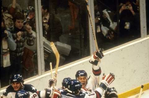 LAKE PLACID, NY – FEBRUARY 22: United States Olympic Hockey players in jubilation after beating the Soviet Union hockey team in the semi-finals hockey game February 22, 1980 during the Winter Olympics in Lake Placid, New York. The United States won the game 4-3. The game was dubbed The Miracle On Ice. (Photo by Focus on Sport/Getty Images)