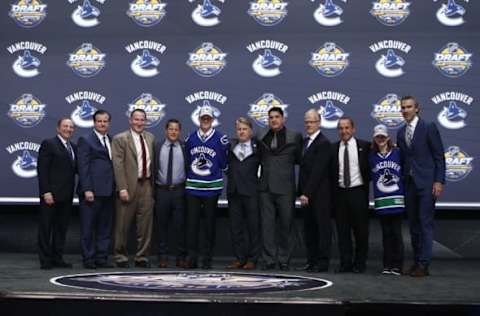 Jun 24, 2016; Buffalo, NY, USA; Olli Juolevi poses for a photo after being selected as the number five overall draft pick by the Vancouver Canucks in the first round of the 2016 NHL Draft at the First Niagra Center. Mandatory Credit: Timothy T. Ludwig-USA TODAY Sports