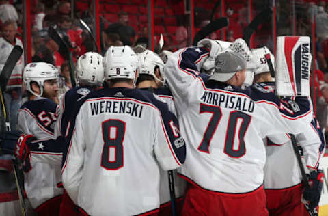 RALEIGH, NC – OCTOBER 10: The Columbus Blue Jackets celebrate their 2-1 victory over the Carolina Hurricanes following an overtime goal by Sonny Milano during of an NHL game on October 10, 2017 at PNC Arena in Raleigh, North Carolina. (Photo by Gregg Forwerck/NHLI via Getty Images)