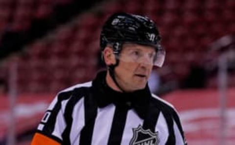 Feb 22, 2021; Sunrise, Florida, USA; NHL referee Tim Peel (20) works the game between the Florida Panthers and the Dallas Stars during the the third period at BB&T Center. Mandatory Credit: Jasen Vinlove-USA TODAY Sports