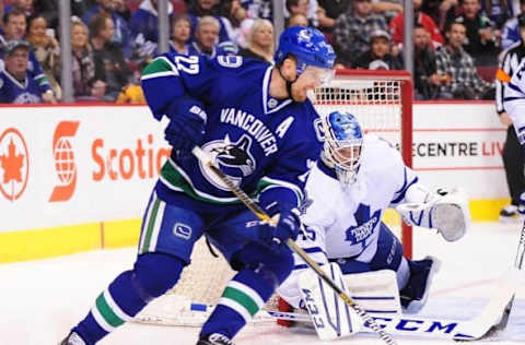 Mar 14, 2015; Vancouver, British Columbia, CAN; Vancouver Canucks forward Daniel Sedin (22) moves the puck against Toronto Maple Leafs goaltender Jonathan Bernier (45) during the first period at Rogers Arena. Mandatory Credit: Anne-Marie Sorvin-USA TODAY Sports