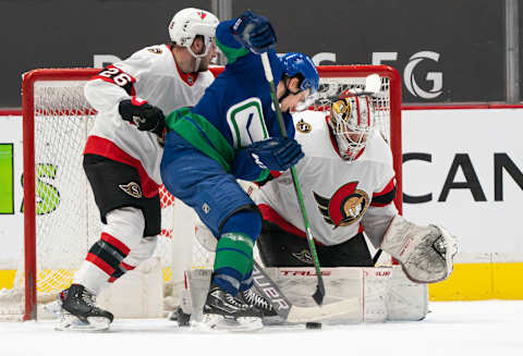 The Vancouver Canucks vs. the Ottawa Senators. (Photo by Rich Lam/Getty Images)