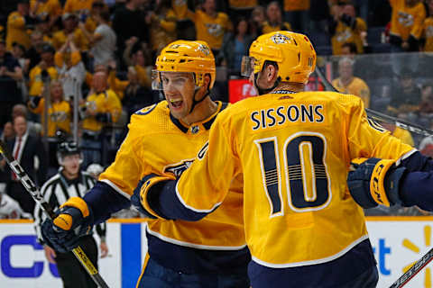 NASHVILLE, TENNESSEE – OCTOBER 10: Nick Bonino #13 of the Nashville Predators is congratulated by teammate Colton Sissons #10 after scoring the game tying goal against the Washington Capitals during the third period of a 6-5 Predators victory over the Capitals at Bridgestone Arena on October 10, 2019 in Nashville, Tennessee. (Photo by Frederick Breedon/Getty Images)