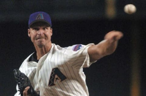 PHOENIX, UNITED STATES: Arizona Diamondbacks’ Randy Johnson delivers a pitch in the second inning against the San Francisco Giants 06 July 2002 in Phoenix. AFP Photo/ROY DABNER (Photo credit should read ROY DABNER/AFP/Getty Images)