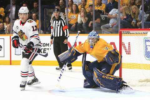 NASHVILLE, TN – APRIL 06: Chicago Blackhawks center Dylan Strome (17) gains position in front of Nashville Predators goalie Pekka Rinne (35) during the NHL game between the Nashville Predators and Chicago Blackhawks, held on April 6, 2019, at Bridgestone Arena in Nashville, Tennessee. (Photo by Danny Murphy/Icon Sportswire via Getty Images)