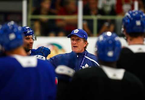 LUCAN, ON – SEPTEMBER 18: Head coach Mike Babcock of the Toronto Maple Leafs talks to his players during a morning skate at Kraft Hockeyville Canada at the Lucan Community Memorial Centre on September 18, 2018 in Lucan, Ontario, Canada. (Photo by Mark Blinch/NHLI via Getty Images)