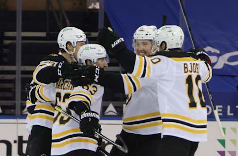 The Boston Bruins celebrate the overtime winning goal by Brad Marchand #63 against the New York Rangers. Mandatory Credit: Bruce Bennett/Pool Photo-USA TODAY Sports