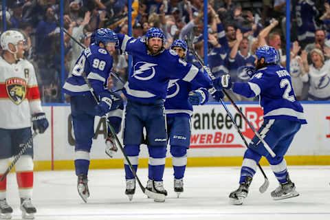 TAMPA, FL – MAY 23: Pat Maroon #14 of the Tampa Bay Lightning, center, celebrates his goal against the Florida Panthers with Mikhail Sergachev #98 and Zach Bogosian #24 during the third period in Game Four of the Second Round of the 2022 Stanley Cup Playoffs at Amalie Arena on May 23, 2022 in Tampa, Florida. (Photo by Mike Carlson/Getty Images)