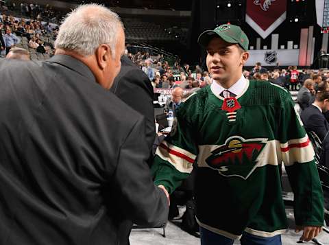 DALLAS, TX – JUNE 23: Alexander Khovanov greets his team after being selected 86th overall by the Minnesota Wild during the 2018 NHL Draft at American Airlines Center on June 23, 2018 in Dallas, Texas. (Photo by Brian Babineau/NHLI via Getty Images)