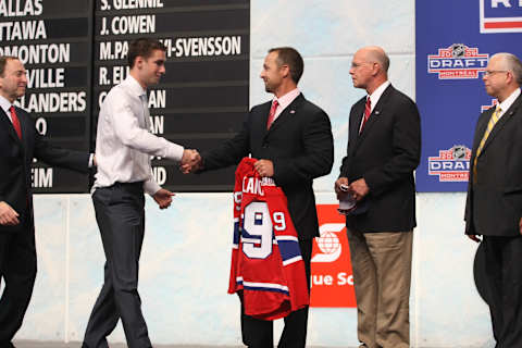 MONTREAL – JUNE 26: Director of Player Recruitment and Development Trevor Timmons of the Montreal Canadiens shakes hands with draft pick Louis Leblanc (Photo by Bruce Bennett/Getty Images)