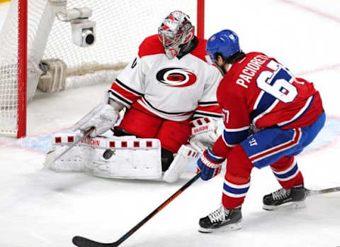 Feb 7, 2016; Montreal, Quebec, CAN; Montreal Canadiens left wing Max Pacioretty (67) shoots on Carolina Hurricanes goalie Cam Ward (30) during the third period at Bell Centre. Mandatory Credit: Jean-Yves Ahern-USA TODAY Sports