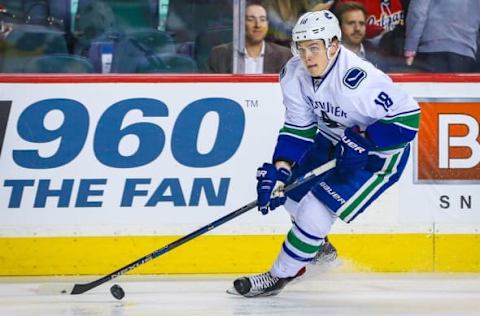 Apr 7, 2016; Calgary, Alberta, CAN; Vancouver Canucks right wing Jake Virtanen (18) skates with the puck against the Calgary Flames during the third period at Scotiabank Saddledome. Calgary Flames won 7-3. Mandatory Credit: Sergei Belski-USA TODAY Sports