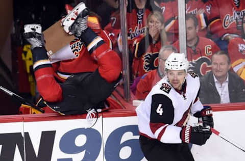 Mar 11, 2016; Calgary, Alberta, CAN; Calgary Flames center Lance Bouma (17) goes over the boards after a check on Arizona Coyotes defenseman Zbynek Michalek (4) during the second period at Scotiabank Saddledome. Mandatory Credit: Candice Ward-USA TODAY Sports