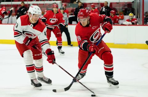 RALEIGH, NC – JUNE 30: Carolina Hurricanes Luke Martin (39) and Carolina Hurricanes Eetu Luostarinen (43) battle for a loose puck during the Canes Prospect Game at the PNC Arena in Raleigh, NC on June 30, 2018. (Photo by Greg Thompson/Icon Sportswire via Getty Images)