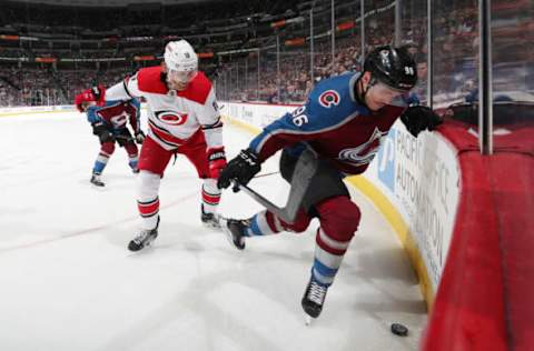 DENVER, CO – MARCH 11: Mikko Rantanen #96 of the Colorado Avalanche battles for position against Dougie Hamilton #19 of the Carolina Hurricanes at the Pepsi Center on March 11, 2019 in Denver, Colorado. (Photo by Michael Martin/NHLI via Getty Images)