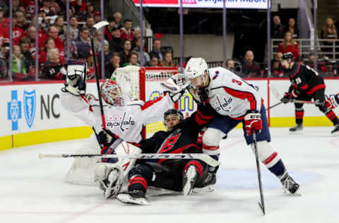 RALEIGH, NC – JANUARY 03: Carolina Hurricanes Left Wing Nino Niederreiter (21) gets tangled up with Washington Capitals Goalie Ilya Samsonov (30) and Washington Capitals Defenceman Nick Jensen (3) in front of the net during an NHL game between the Carolina Hurricanes and the Washington Capitals on January 3, 2020, at the PNC Arena in Raleigh, NC. (Photo by John McCreary/Icon Sportswire via Getty Images)