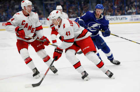 TAMPA, FL – SEPTEMBER 17: Carolina Hurricanes center Eetu Luostarinen (43) skates with the puck during the NHL Preseason game between the Carolina Hurricanes and Tampa Bay Lightning on September 17, 2019 at Amalie Arena in Tampa, FL. (Photo by Mark LoMoglio/Icon Sportswire via Getty Images)