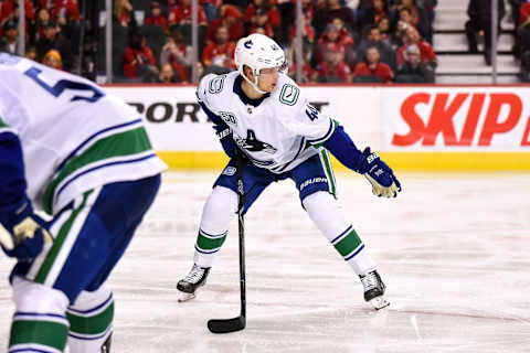 CALGARY, AB – OCTOBER 05: Vancouver Canucks Center Elias Pettersson (40) directs a teammate into position before a face-off during the third period of an NHL game where the Calgary Flames hosted the Vancouver Canucks on October 5, 2019, at the Scotiabank Saddledome in Calgary, AB. (Photo by Brett Holmes/Icon Sportswire via Getty Images)