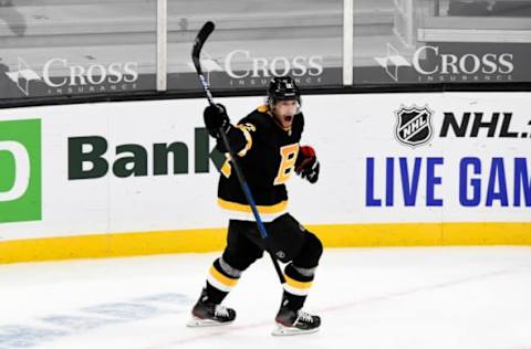 Jan 26, 2021; Boston, Massachusetts, USA; Boston Bruins right wing Craig Smith (12) reacts after scoring the game-winning goal against the Pittsburgh Penguins during an overtime period at the TD Garden. Mandatory Credit: Brian Fluharty-USA TODAY Sports