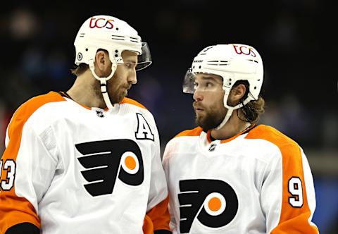 NEW YORK, NEW YORK – APRIL 22: Kevin Hayes #13 and Ivan Provorov #9 of the Philadelphia Flyers talk before a face off against the New York Rangers at Madison Square Garden on April 22, 2021 in New York City.The Philadelphia Flyers defeated the New York Rangers 3-2. (Photo by Elsa/Getty Images)