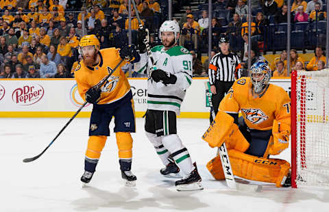 NASHVILLE, TN – FEBRUARY 7: Tyler Seguin #91 of the Dallas Stars battles between Ryan Ellis #4 and Juuse Saros #74 of the Nashville Predators at Bridgestone Arena on February 7, 2019 in Nashville, Tennessee. (Photo by John Russell/NHLI via Getty Images)