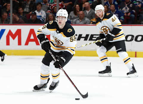 VANCOUVER, BC – OCTOBER 20: Urho Vaakanainen #58 of the Boston Bruins skates up ice with the puck during their NHL game against the Vancouver Canucks at Rogers Arena October 20, 2018 in Vancouver, British Columbia, Canada. Vancouver won 2-1 in overtime. (Photo by Jeff Vinnick/NHLI via Getty Images)