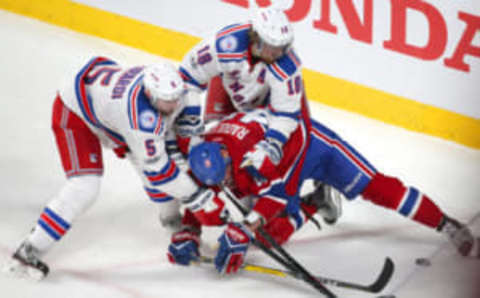 New York Rangers defenseman Marc Staal (18) and defenseman Dan Girardi (5) battle for the puck against Montreal Canadiens right wing Alexander Radulov (47) (Yves Ahern-USA TODAY Sports)