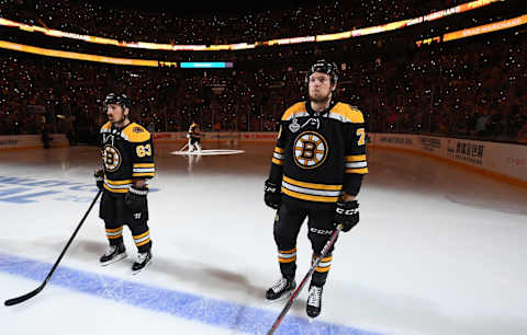 BOSTON, MA – JUNE 6: Brad Marchand #63 and Charlie McAvoy #73 of the Boston Bruins during the playing of the National Anthem prior to the start of the game against the St Louis Blues during Game Five of the 2019 NHL Stanley Cup Final at the TD Garden on June 6, 2019 in Boston, Massachusetts. (Photo by Brian Babineau/NHLI via Getty Images)