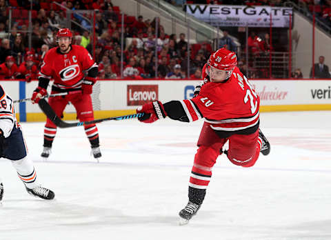 RALEIGH, NC – MARCH 20: Sebastian Aho #20 of the Carolina Hurricanes fires a slap shot on goal and scores during an NHL game against the Edmonton Oilers on March 20, 2018 at PNC Arena in Raleigh, North Carolina. (Photo by Gregg Forwerck/NHLI via Getty Images)