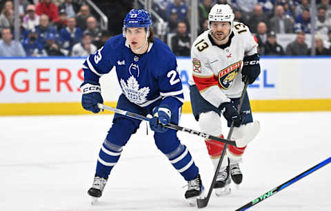 May 2, 2023; Toronto, Ontario, CANADA; Toronto Maple Leafs forward Matthew Knies (23) and Florida Panthers forward Sam Reinhart   Mandatory Credit: Dan Hamilton-USA TODAY Sports