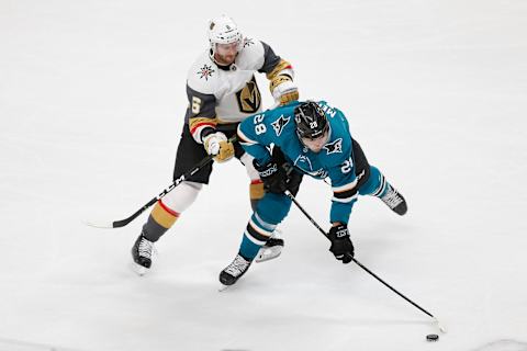 SAN JOSE, CA – APRIL 23: Colin Miller #6 of the Vegas Golden Knights competes for the puck against Timo Meier #28 of the San Jose Sharks in Game Seven of the Western Conference First Round during the 2019 NHL Stanley Cup Playoffs at SAP Center on April 23, 2019 in San Jose, California. (Photo by Lachlan Cunningham/Getty Images)