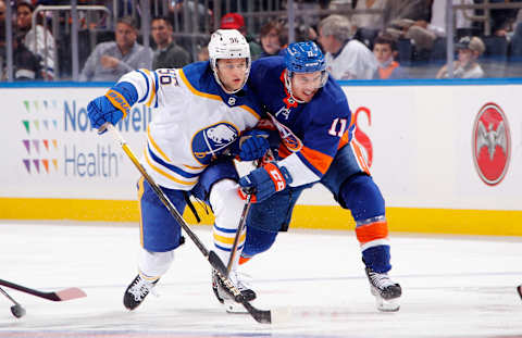 ELMONT, NEW YORK – DECEMBER 30: Zach Parise #11 of the New York Islanders battles for position with Anders Bjork #96 of the Buffalo Sabres during the third period at the UBS Arena on December 30, 2021 in Elmont, New York. (Photo by Bruce Bennett/Getty Images)