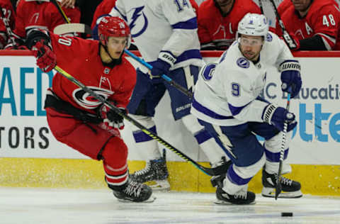 RALEIGH, NC – OCTOBER 06: Carolina Hurricanes Center Sebastian Aho (20) chases after Tampa Bay Lightning Center Tyler Johnson (9) during a game between the Tampa Bay Lightning and the Carolina Hurricanes at the PNC Arena in Raleigh, NC on October 6, 2019.(Photo by Greg Thompson/Icon Sportswire via Getty Images)