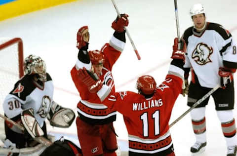 RALEIGH, NC – JUNE 01: Rod Brind’Amour #17 of the Carolina Hurricanes celebrates his game-winning goal with teammate Justin Williams #11 during the third period against the Buffalo Sabres in game seven of the Eastern Conference Finals in the 2006 NHL Playoffs on June 1, 2006 at RBC Arena in Raleigh, North Carolina. The Hurricanes won the game 4-3 and advance to the Stanley Cup Finals against the Edmonton Oilers. (Photo by Grant Halverson/Getty Images)