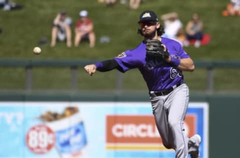 SCOTTSDALE, AZ – FEBRUARY 26: Colorado Rockies shortstop Brendan Rodgers (65) makes a throw to first base for an out during the first inning against the Arizona Diamondbacks on February 26, 2018 at Salt River Fields at Talking Stick. (Photo by John Leyba/The Denver Post via Getty Images)