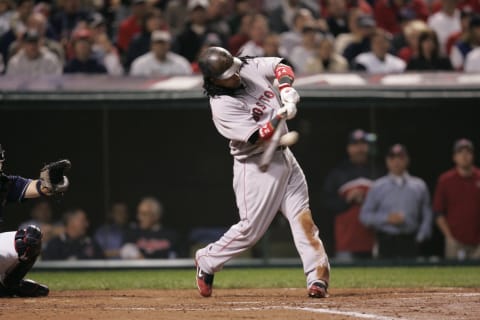 CLEVELAND – OCTOBER 16: Manny Ramirez of the Boston Red Sox hits a home run during the game against the Cleveland Indians at Jacobs Field in Cleveland, Ohio on October 16, 2007. The Indians defeated the Red Sox 7-3. (Photo by John Reid III/MLB Photos via Getty Images)