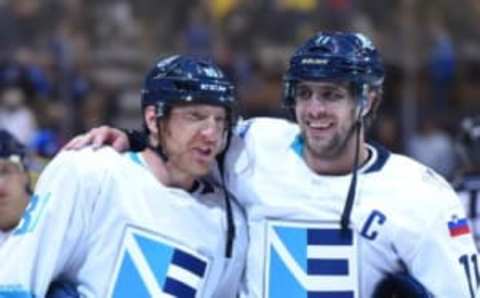 Sep 25, 2016; Toronto, Ontario, Canada; Team Europe forwards Anze Kopitar (11) and Marian Hossa (81) skate off the ice in celebration after a 3-2 overtime win over Team Sweden during a semifinal game in the 2016 World Cup of Hockey at Air Canada Centre. Mandatory Credit: Dan Hamilton-USA TODAY Sports