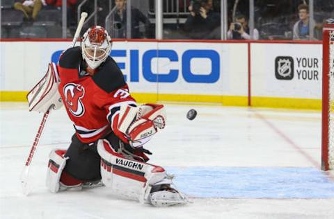 Mar 28, 2017; Newark, NJ, USA; New Jersey Devils goalie Cory Schneider (35) makes a glove save during the third period at Prudential Center. The Jets defeated the Devils 4-3 in a shootout. Mandatory Credit: Ed Mulholland-USA TODAY Sports