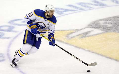 Dec 17, 2021; Pittsburgh, Pennsylvania, USA; Buffalo Sabres left wing Zemgus Girgensons (28) skates with the puck against the Pittsburgh Penguins during the second period at PPG Paints Arena. Mandatory Credit: Charles LeClaire-USA TODAY Sports