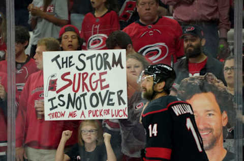 RALEIGH, NC – MAY 16: Fans of Justin Williams #14 the Carolina Hurricanes celebrate during pregame warmups in Game Four of the Eastern Conference Third Round against the Boston Bruins during the 2019 NHL Stanley Cup Playoffs on May 16, 2019 at PNC Arena in Raleigh, North Carolina. (Photo by Gregg Forwerck/NHLI via Getty Images)