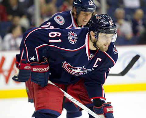 March 23, 2012; Columbus, OH, USA; Columbus Blue Jackets right wing Rick Nash (61) lines up for a face off in the game against the Carolina Hurricanes at Nationwide Arena. Columbus won the game 5-1. Mandatory Credit: Greg Bartram-USA TODAY Sports