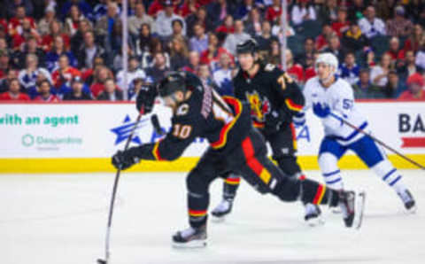 Mar 2, 2023; Calgary, Alberta, CAN; Calgary Flames center Jonathan Huberdeau (10) shoot the puck against the Toronto Maple Leafs during the second period at Scotiabank Saddledome. Mandatory Credit: Sergei Belski-USA TODAY Sports